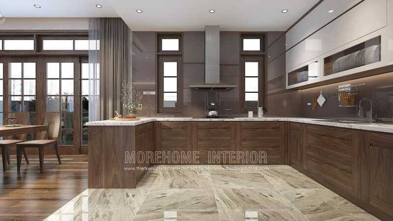 Mẫu tủ bếp màu nâu trầm ấn tượng từ gỗ óc chó, thiết kế liền bàn đảo hiện đại mang lại sự thuận tiện cho gia chủ trong quá trình nấu nướng và bày biện trang trí đồ ăn Thiết kế phòng bếp, tủ bếp đẹp