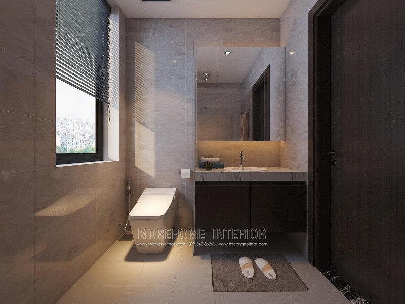 Tủ phòng tắm màu trầm kết hợp cùng mặt bàn đá lavabor cùng thiết kế hiện đại giúp cho phòng tắm nhỏ trở nên đẹp, sang trọng và đầy tiện ghi. Thiết kế chung cư