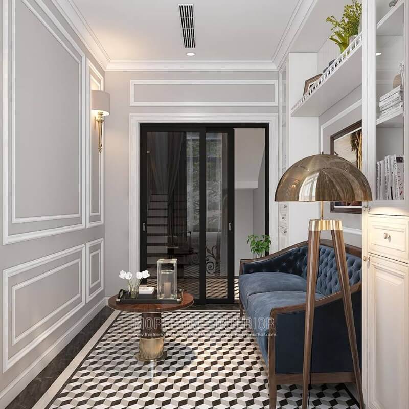 Gạch lát nền giả cổ, sofa văng gỗ óc chó tân cổ điển bọc nệm xanh cùng tường trắng đơn sắc đã tạo nên không gian đẹp sang trọng, đáp ứng tối đa công năng cho phòng đọc sách. Mẫu nội thất biệt thự tân cổ điển đẹp