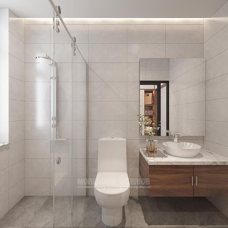 Thiết kế phòng tắm đẹp và hiện đại với ý tưởng sử dụng gam màu đơn sắc màu xám chủ đạo kết hợp chất liệu gỗ óc chó. Mẫu thiết kế sẽ là lựa chọn rất phù hợp trong các không gian vừa và nhỏ như chung cư, nhà phố, nhà liền kề,.. Thiết kế chung cư