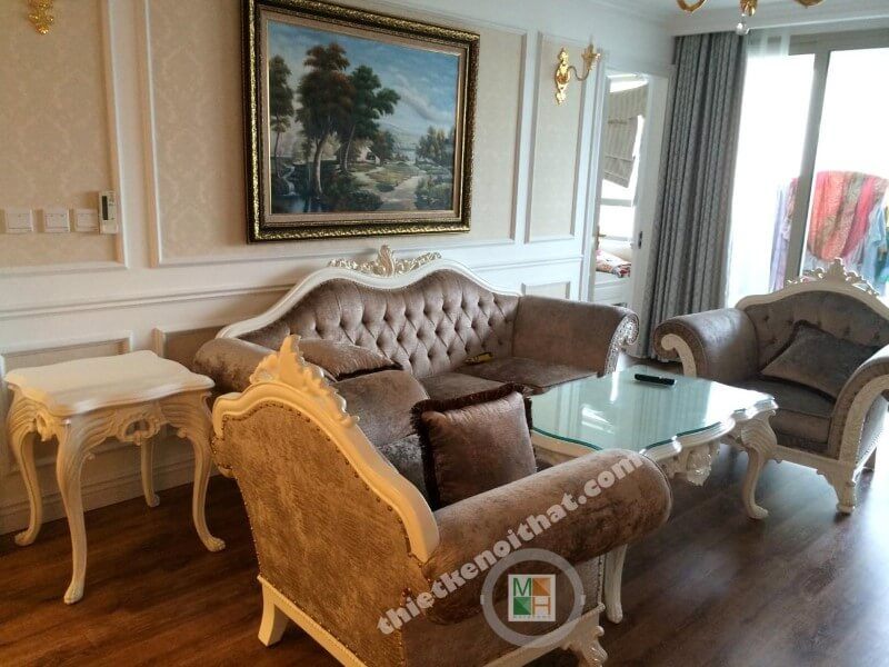 Không gian nội thất phòng khách bố trí với sofa bộ, tranh, kệ trang trí, hệ tủ tivi,...
